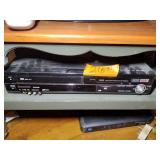Insignia TV and Panasonic DVD player with remotes.