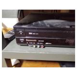 Insignia TV and Panasonic DVD player with remotes.