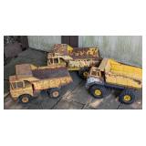 Three Vintage Tonka Dump Trucks