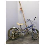 Vintage bicyle and cane pole ...