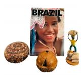 Brazilian Decor including Book, Hand Carved Brazilian Nut Pot Rattle, Peruvian Gourd and Cuban Folk-art Figurine Depicting a Coffee Worker