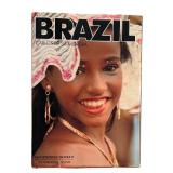 Brazilian Decor including Book, Hand Carved Brazilian Nut Pot Rattle, Peruvian Gourd and Cuban Folk-art Figurine Depicting a Coffee Worker