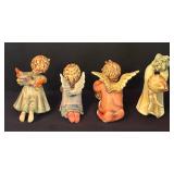 Four Angelic Hummel Figurines including Flying High, Angelic Guide, Light Up the Night and Peace on Earth