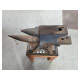 Set of Metal Anvils on Wooden Stand