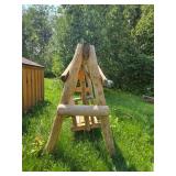 Rustic Wooden Outdoor Swing with Log Construction