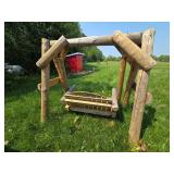 Rustic Wooden Outdoor Swing with Log Construction