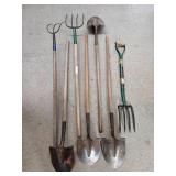 Collection of Garden Tools Including Forks and Shovels