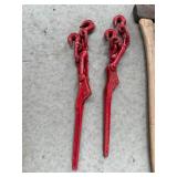 Collection of Farm Tools and Equipment including Chains, Axe, and Stakes