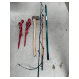 Collection of Farm Tools and Equipment including Chains, Axe, and Stakes