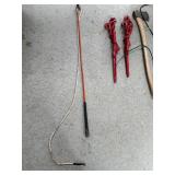 Collection of Farm Tools and Equipment including Chains, Axe, and Stakes