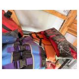 Collection of Adult and Youth Life Vests, Various Sizes and Colors