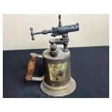 Vintage Collection: Watering Can, Woodlink Squirrel Feeder, Brass Blowtorch, and Ceramic Jar