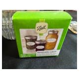 Collection of Vintage Coolers and Canning Jars with Accessories