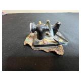 Collection of Quilting Fabrics, Calendar, Vintage Sewing Machine Figurine/Ornament, and Jar of Sewing Notions