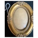 Collection of Decorative Items Including Frames and Iridescent Glass Bowl
