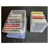 Collection of Music CDs in Plastic Storage Bins