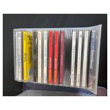 Collection of Music CDs in Plastic Storage Bins