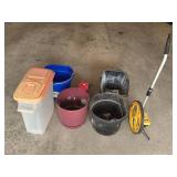 Assorted Household and Garage Items Including Measuring Wheel, Containers, and Buckets