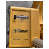 Assorted Household and Garage Items Including Measuring Wheel, Containers, and Buckets