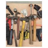 Assorted Collection of Hand Tools Including Hammers, Saws, and Screwdrivers