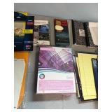 Assortment of Office Supplies including Address Labels, Paper, and Envelopes