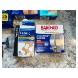 Assortment of Band-Aids, Fabric Bandages, Bathroom Cleaner Wipes & Razors - content quantities unverified
