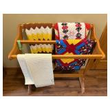 Wooden Quilt Rack with Assorted Patterned Quilts & A Knit Throw