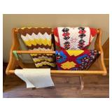 Wooden Quilt Rack with Assorted Patterned Quilts & A Knit Throw