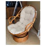 Rattan Swivel Chair with Cushion and Red Accent Pillow