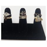 Group of 12 Gold Tone Base Metal Rings. Size 7-7.5.