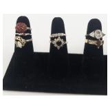 Group of 12 Gold Tone Base Metal Rings. Size 7-7.5.