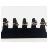 Group of 12 Gold Tone Base Metal Rings. Size 7-7.5.
