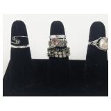 Group of 10 Silver Tone Base Metal Rings. Size 7-7.75.