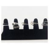 Group of 10 Silver Tone Base Metal Rings. Size 7-7.75.