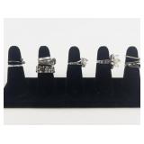 Group of 10 Silver Tone Base Metal Rings. Size 7-7.75.