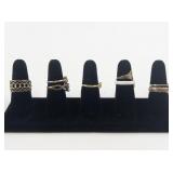 Group of 8 Gold Tone Base Metal Rings. Size 8.75-9.75.