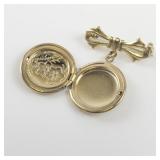 Cute Bow & Locket Gold Tone Base Metal Brooch .