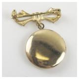 Cute Bow & Locket Gold Tone Base Metal Brooch .