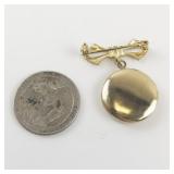 Cute Bow & Locket Gold Tone Base Metal Brooch .