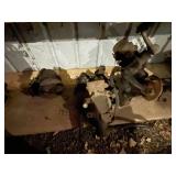 Collection of Used Automotive Parts Including Headlights and Radiator