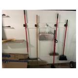 Collection of Cleaning Tools Including Brooms and Dust Pan
