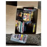 Mixed Media Collection of DVDs and CDs Featuring Movies and Music