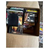 Mixed Media Collection of DVDs and CDs Featuring Movies and Music