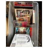 Mixed Media Collection of DVDs and CDs Featuring Movies and Music