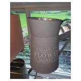 Collection of Garden Planters, Watering Cans, and Decorative Jars