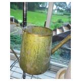 Collection of Garden Planters, Watering Cans, and Decorative Jars