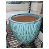 Collection of Garden Planters, Watering Cans, and Decorative Jars