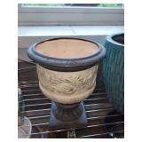 Collection of Garden Planters, Watering Cans, and Decorative Jars