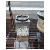 Collection of Garden Planters, Watering Cans, and Decorative Jars