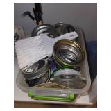 Collection of Mason Jars with Lids and Canning Supplies